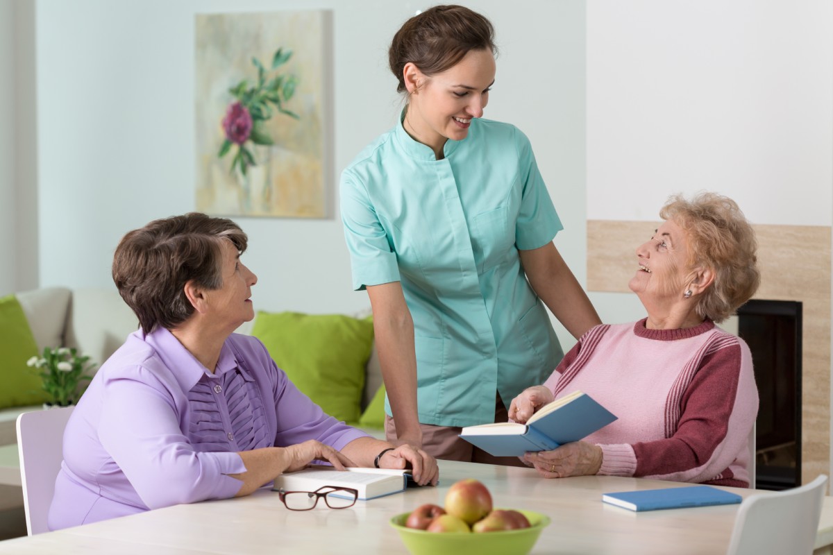 Carer supporting elderly clients